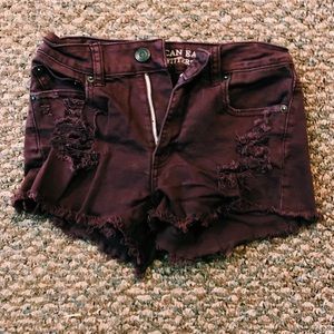 two pairs of maroon jean shorts